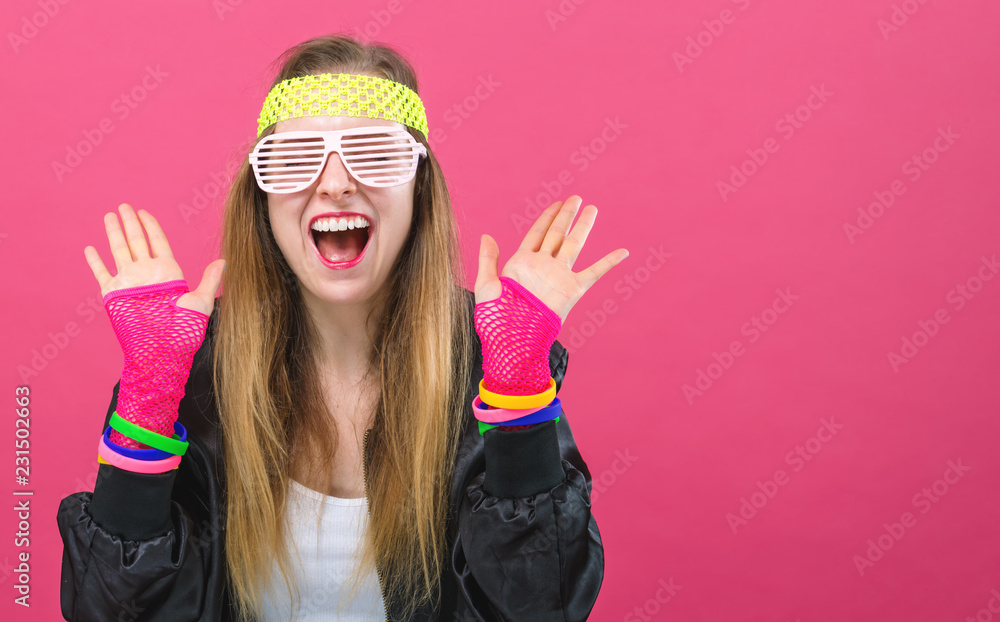 Woman in 1980s fashion theme on a pink background