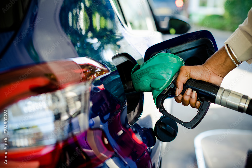 Man filling up gas in his car