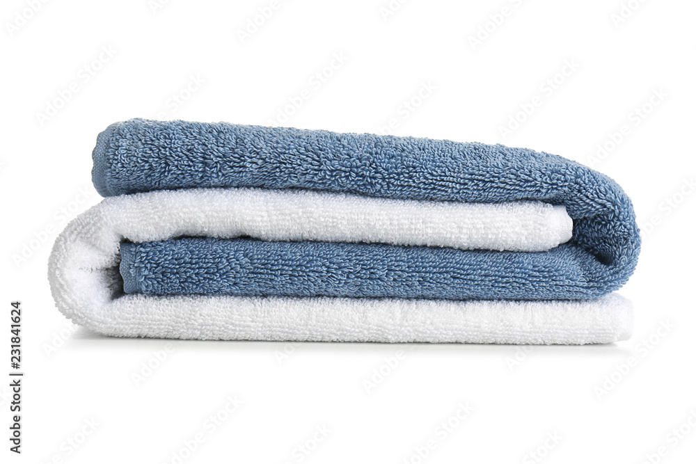 Stack of clean soft towels on white background