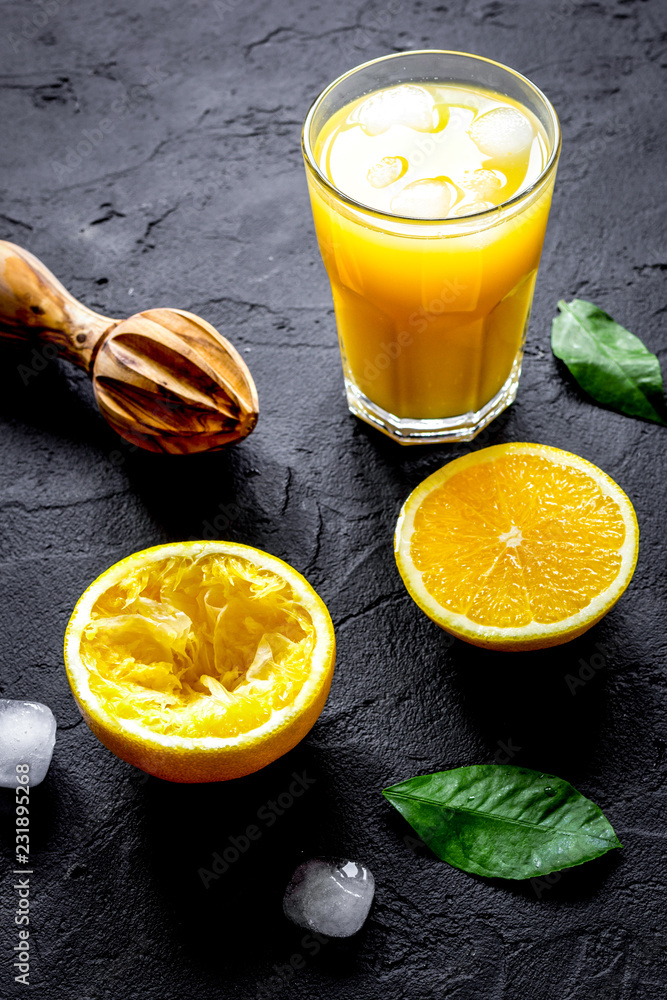 freshly squeezed orange juice on dark background