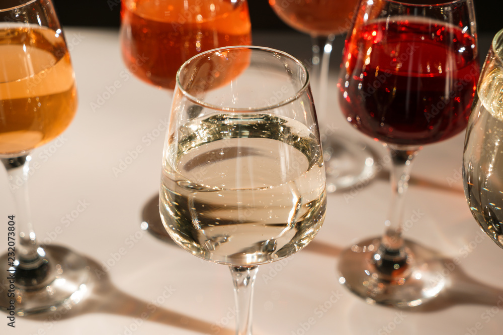 Glasses of different wine on table