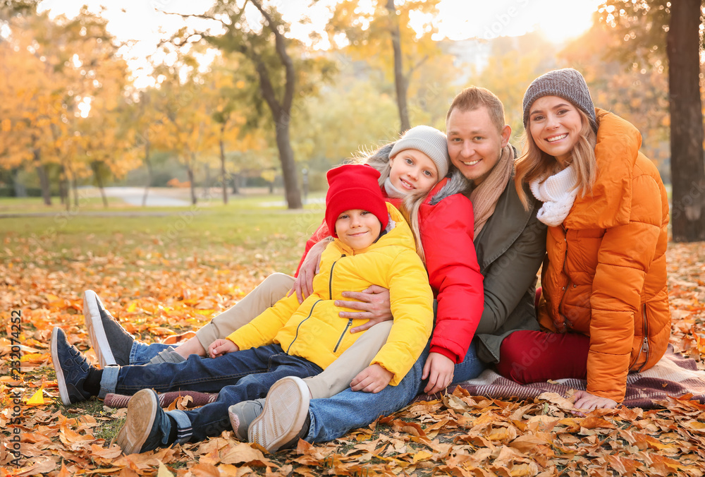 Happy family in autumn park