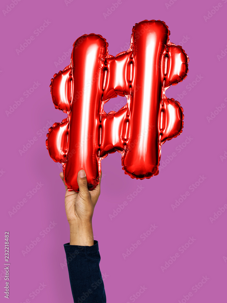 Hand holding balloon hashtag symbol #