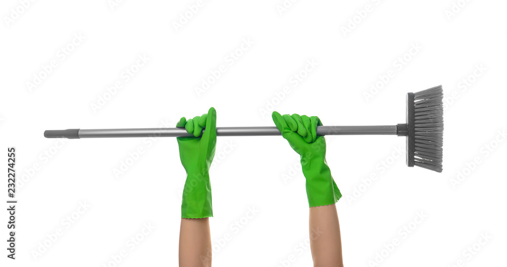 Woman holding floor brush on white background