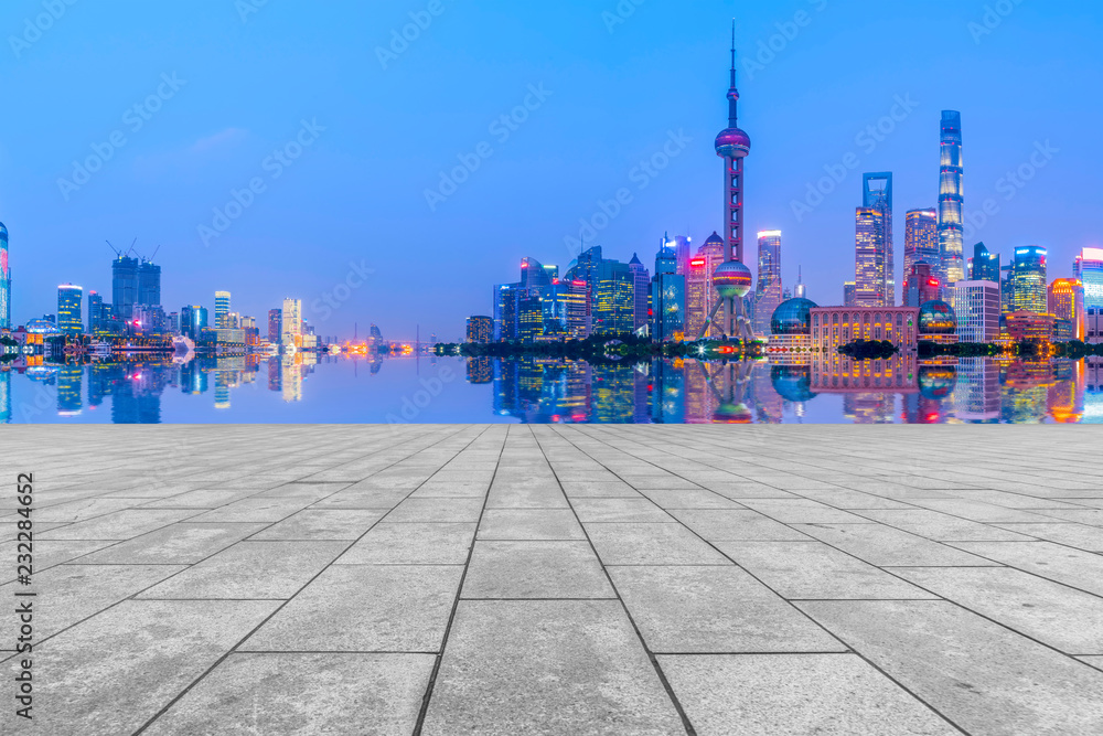 Blue sky, empty marble floor and skyline of Shanghai urban architecture.