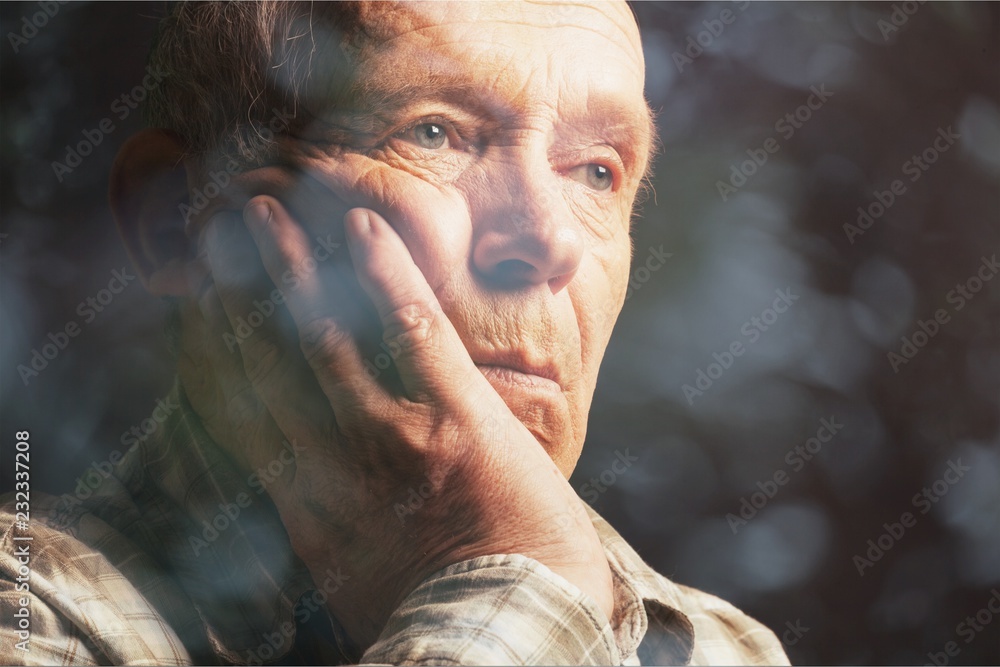 Thoughtful senior man at home