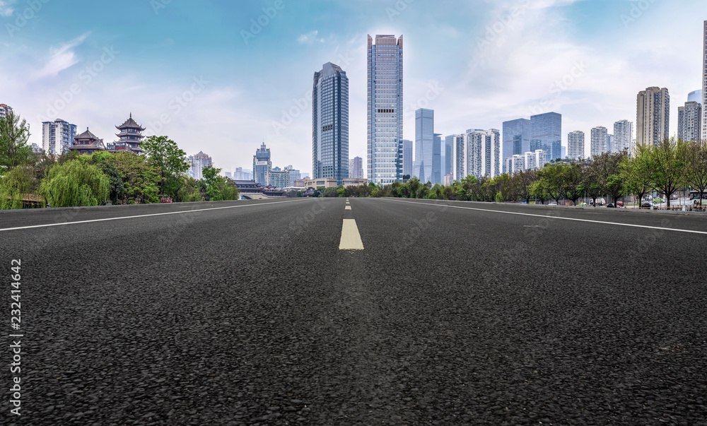 City skyscrapers and road asphalt pavement