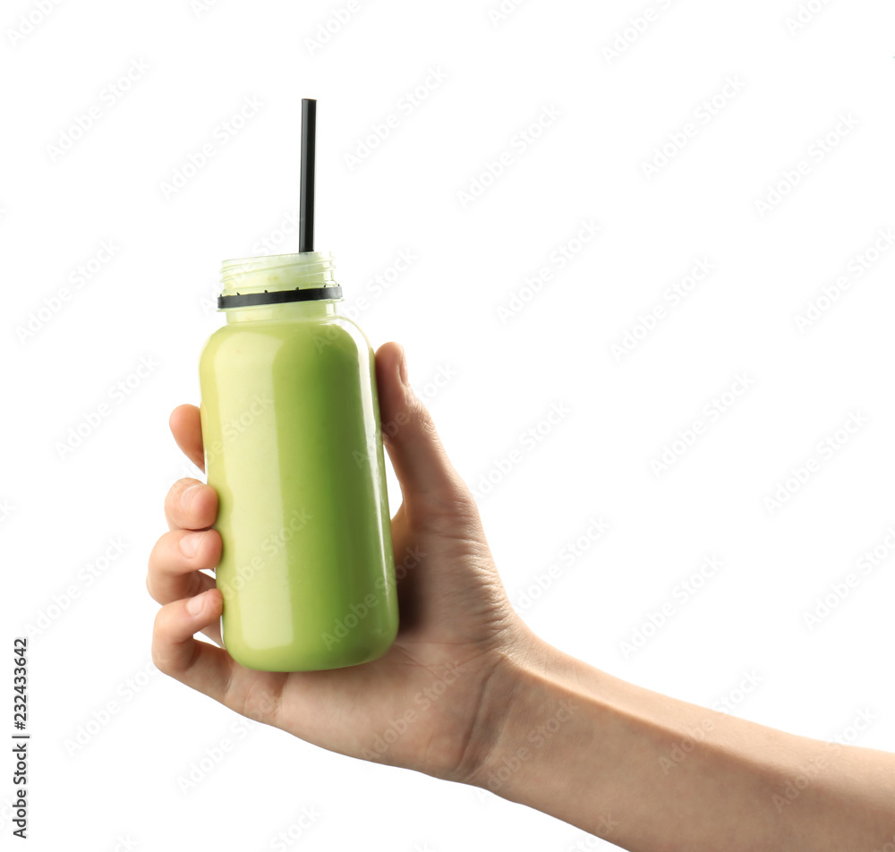 Female hand holding bottle of avocado smoothie on white background