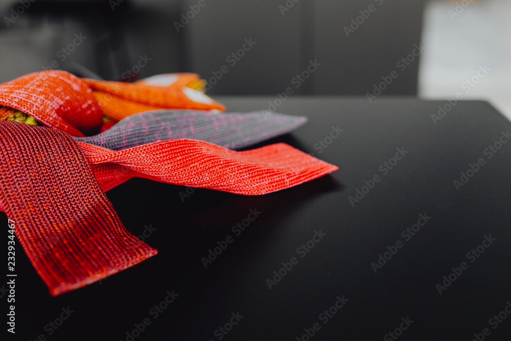 Closeup of textile samples on a black table