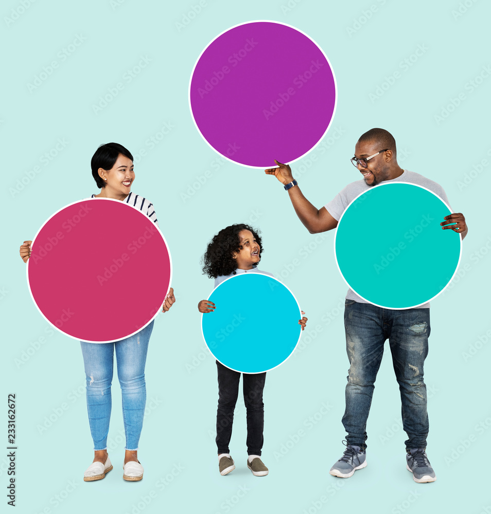 Happy family holding round colorful boards