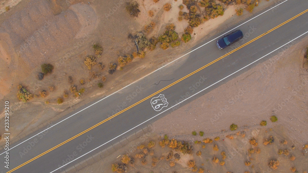 AERIAL: Cars driving on along the historic Route 66 in USA, people traveling