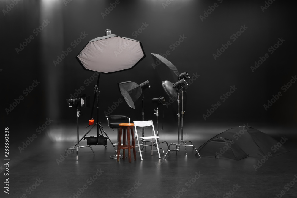 Professional lighting equipment on dark background