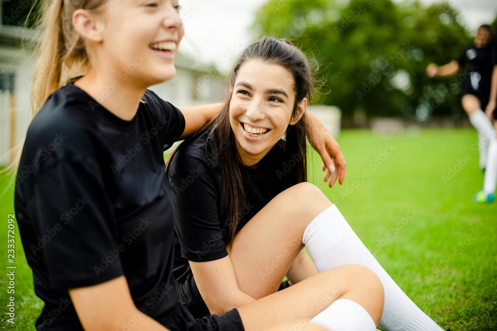 Female football players and friendship concept