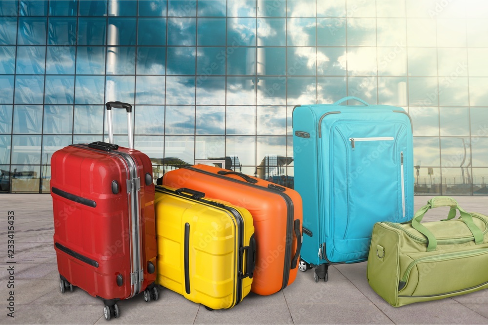 Colorful suitcases isolated on white background