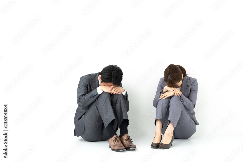 sad business group sitting on white background