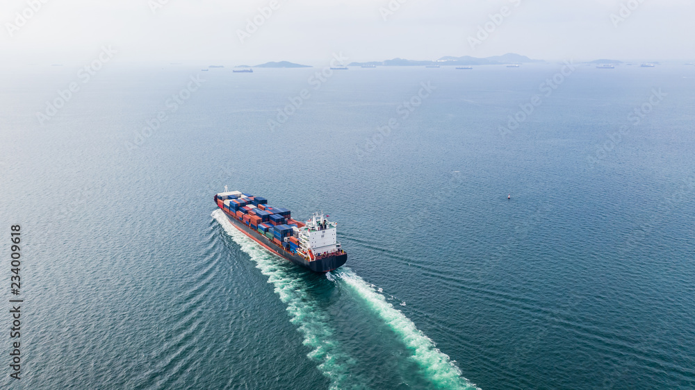 Aerial view cargo container ship sailing, container cargo ship in import export and business logisti