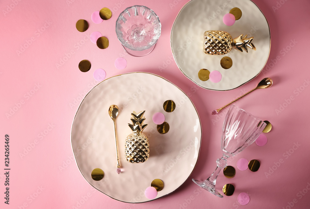 Stylish table setting with plates, spoons and glasses