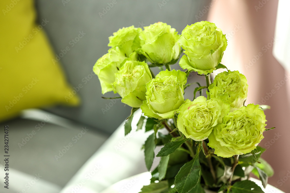 Vase with beautiful green roses, closeup