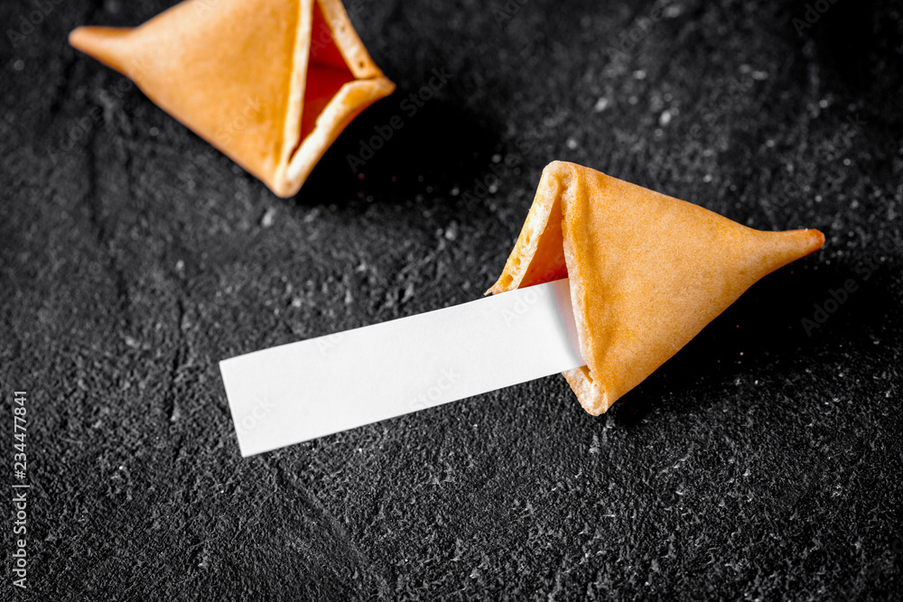 Chinese fortune cookie with prediction on dark background top vi