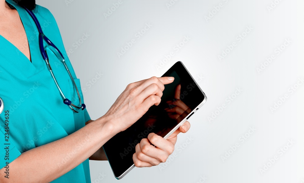 Close-up Doctor at hospital working with tablet pc