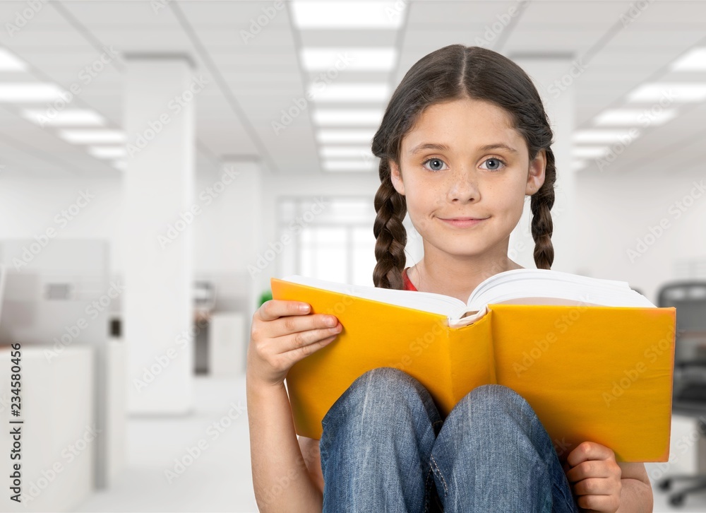 Education and school concept -  little student girl with  book