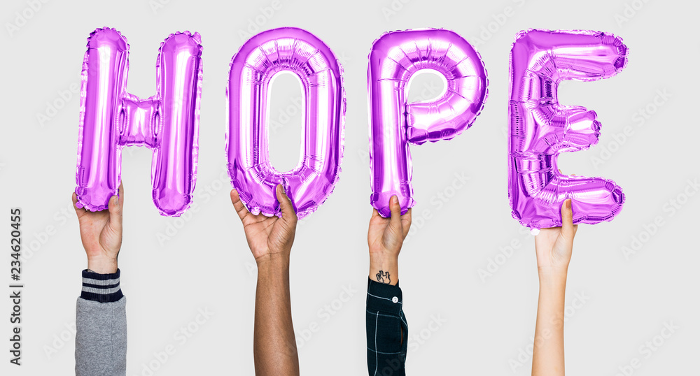 Hands holding hope word in balloon letters