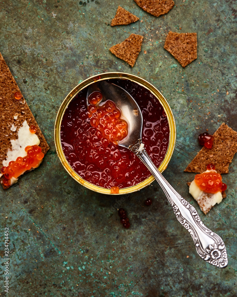 red caviar int tin with crispbreads and butter