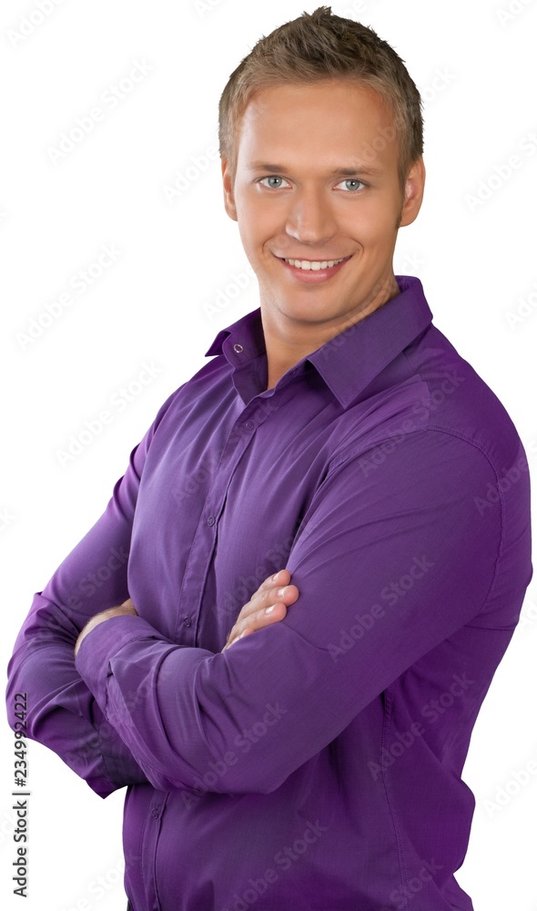 Causually dressed male with his arms crossed