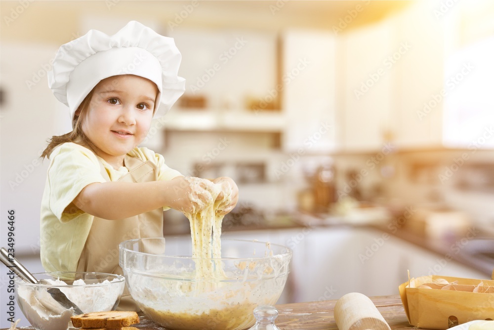 Portrait of adorable little girl preparing healthy food at