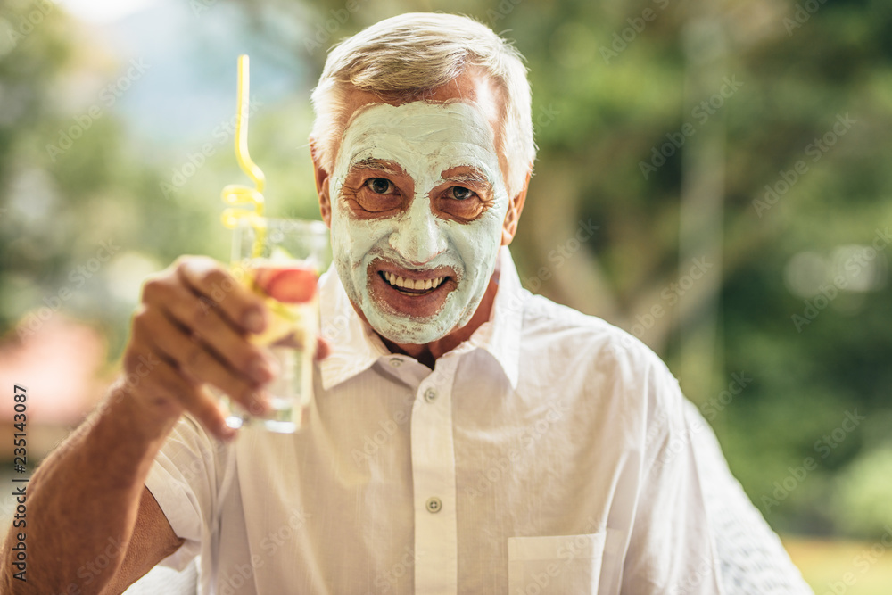 Man having spa facial treatment at retired age