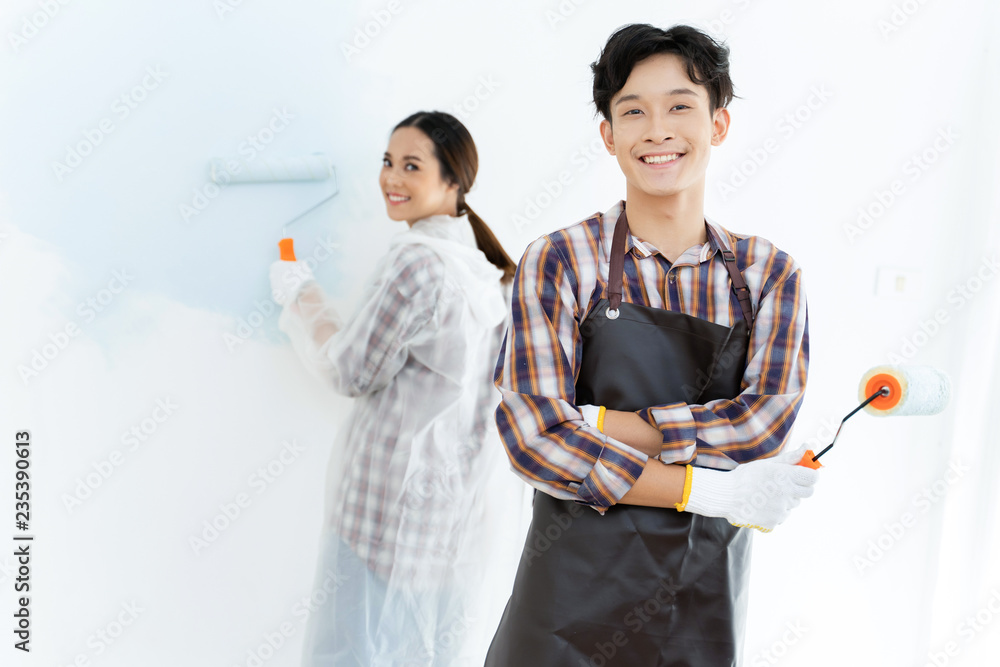 Couples are helping to paint the new house. They are happy.