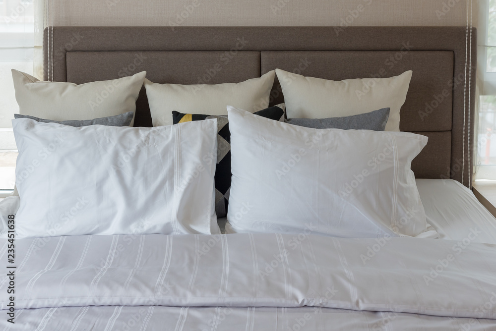 white pillows on bed in modern bedroom