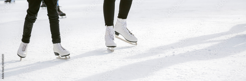 People ice skating on ice rink