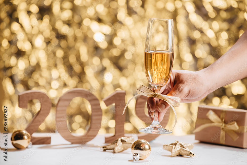 New Years Eve celebration background with pair of flutes, bottle of champagne