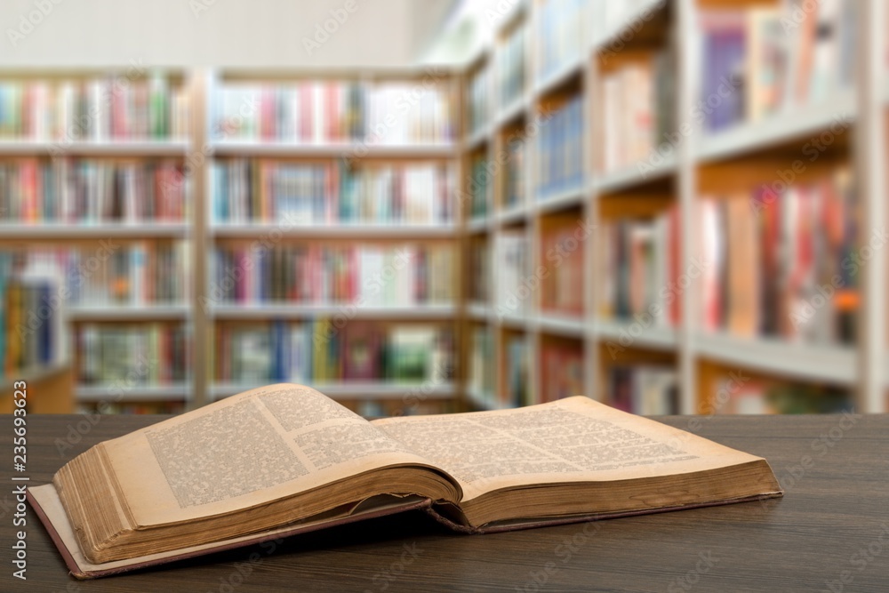 Open book on old wooden table