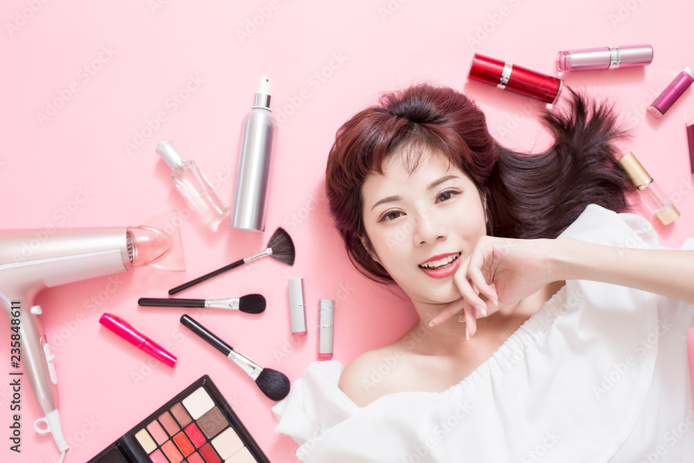 woman smile with makeup tools