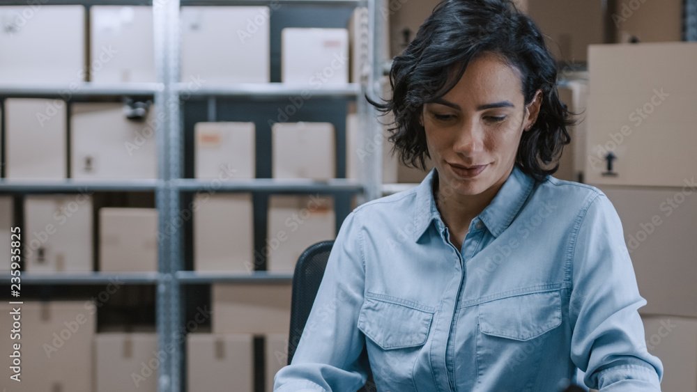 Portrait of Beautiful Female Warehouse Inventory Manager Working with Documents. Talented Career Wom