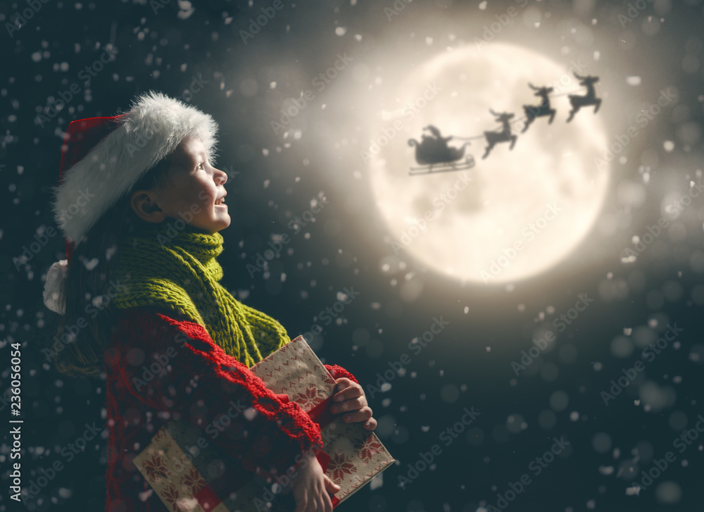 girl with present at Christmas