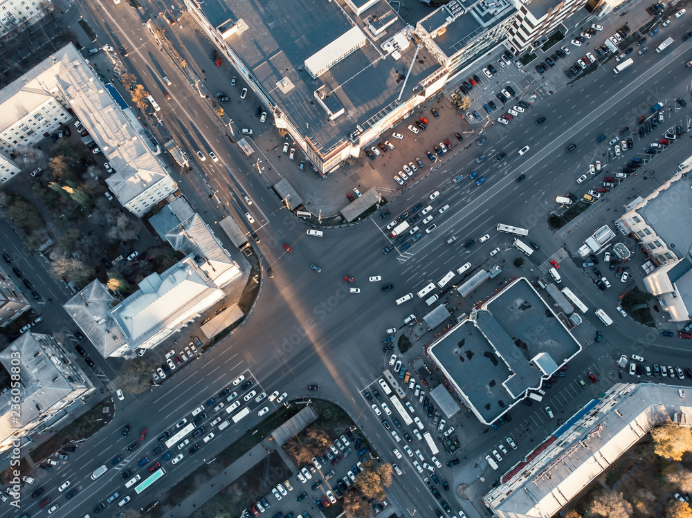 Road car traffic on crossroad or intersection downtown on asphalt road of European city, aerial or t