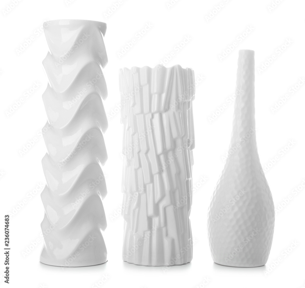 Beautiful different vases on white background