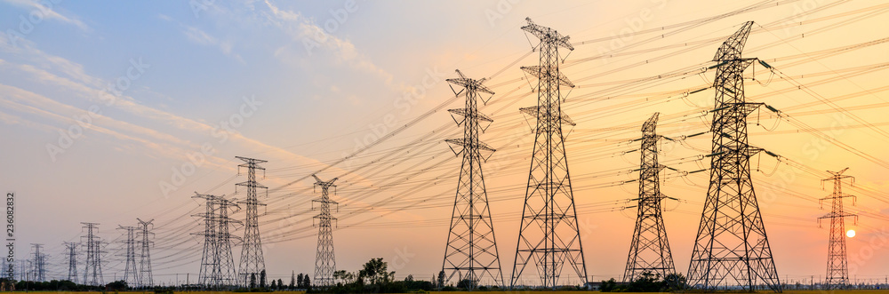 high-voltage power lines at sunset,high voltage electric transmission tower