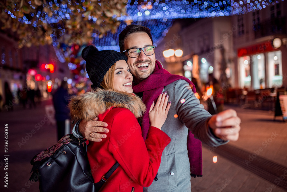 Cute couple enjoy spending time together in New Years Eve.