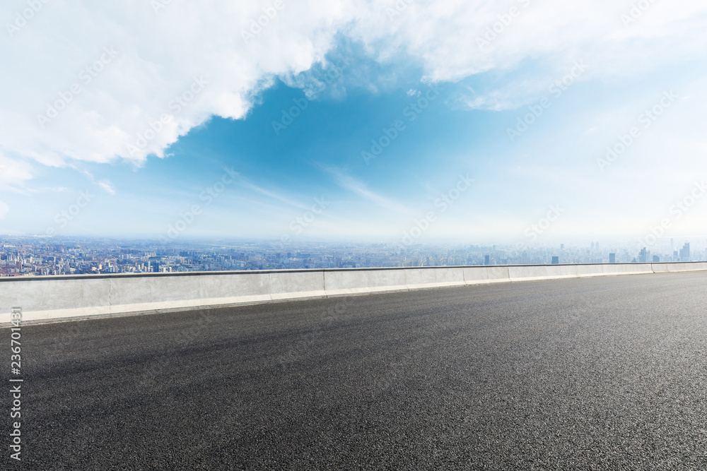 Panoramic city skyline and buildings with empty asphalt road