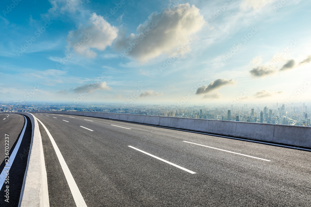 Panoramic city skyline and buildings with empty asphalt road