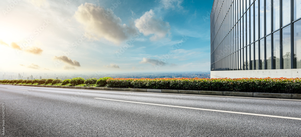 Panoramic city skyline and buildings with empty asphalt road