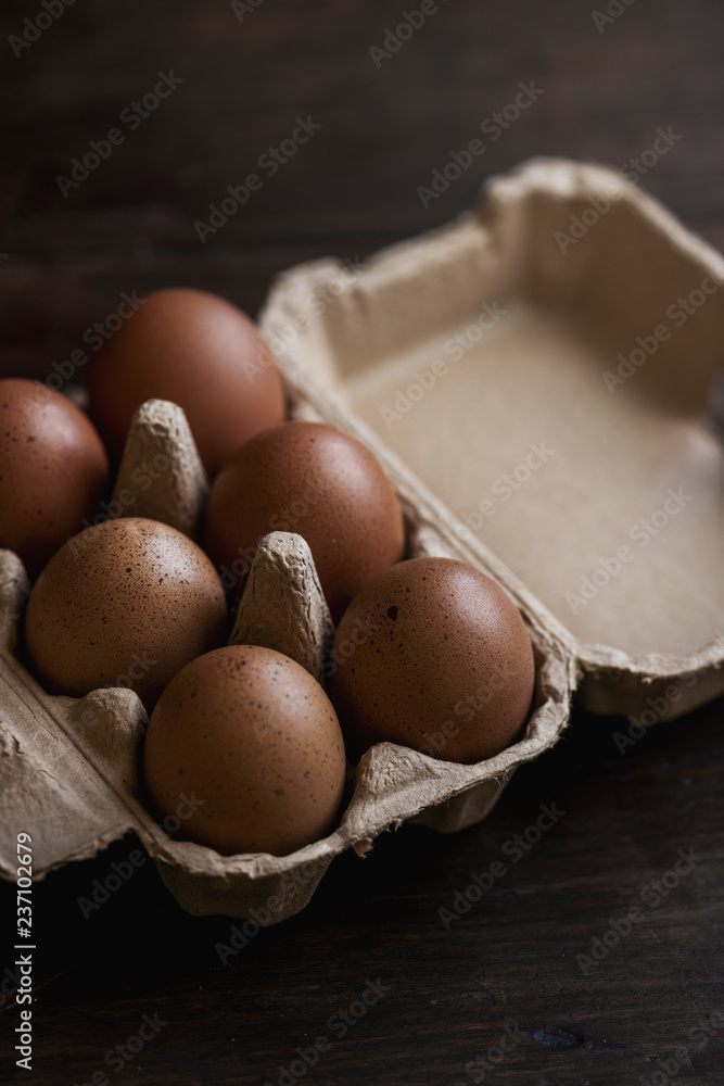 Closeup of fresh organic eggs in a paper box