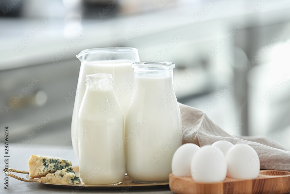 Different milk products with eggs on table