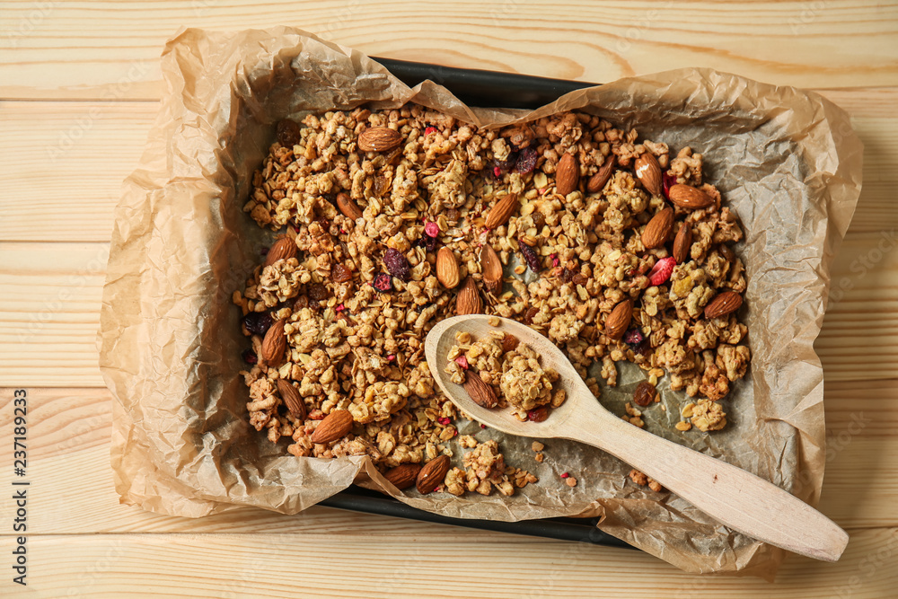 Delicious granola with almond nuts on baking tray