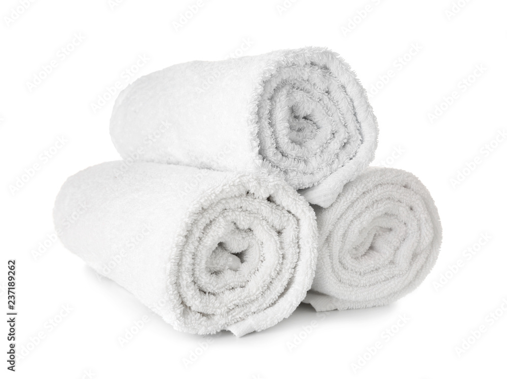 Clean rolled towels on white background