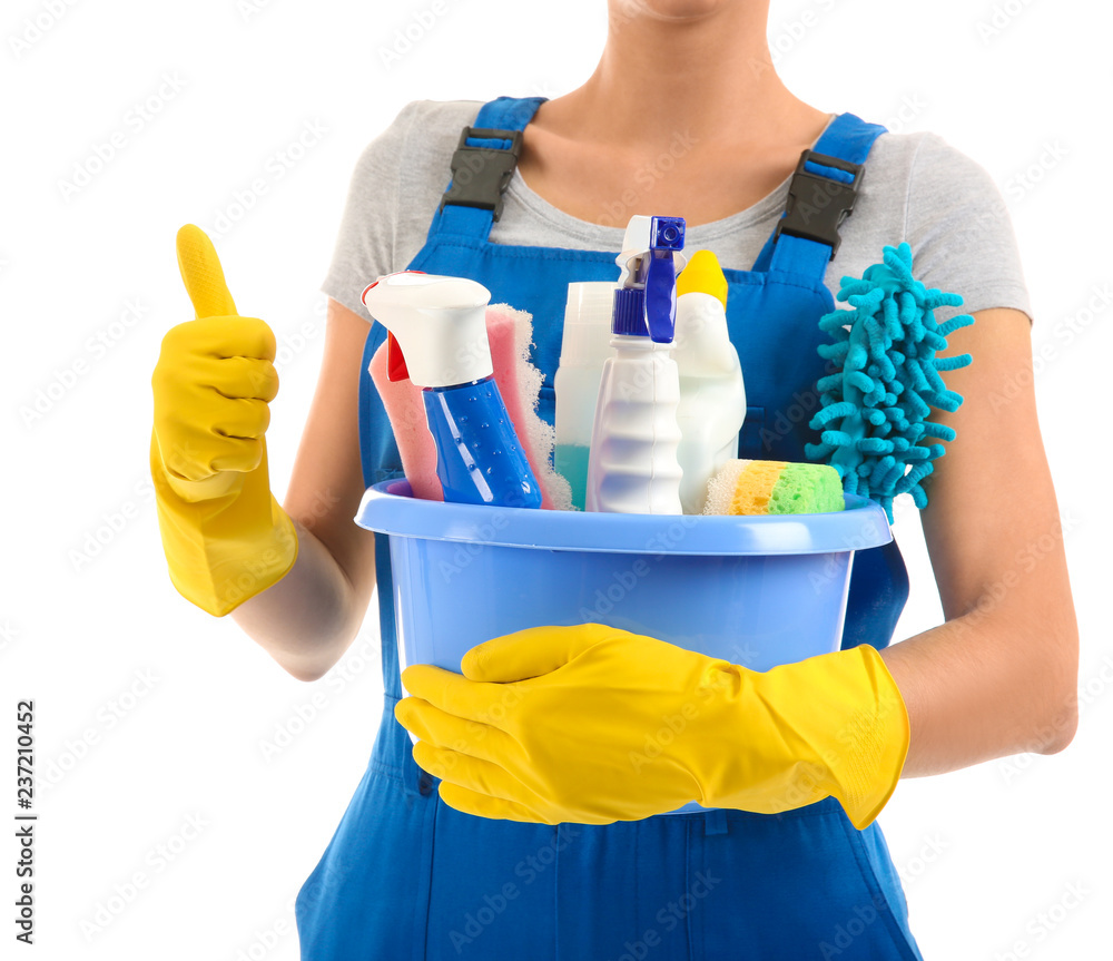 Woman with cleaning supplies on white background